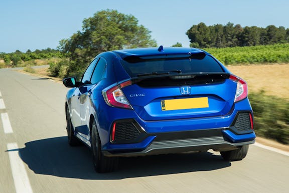 Rear exterior shot of a blue Honda Civic