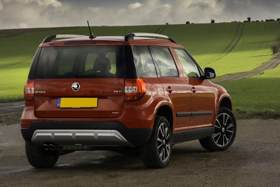 The rear exterior of an orange Skoda Yeti