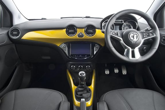 The interior of a Vauxhall Adam with steering wheel and dashboard in shot