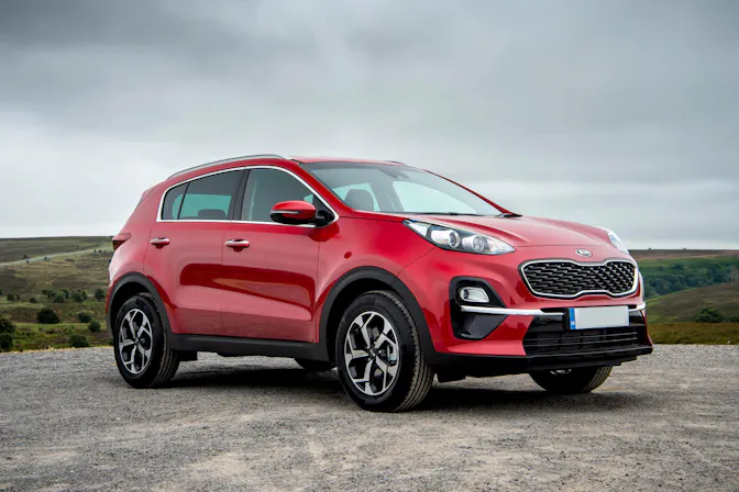 The exterior of a red Kia Sportage