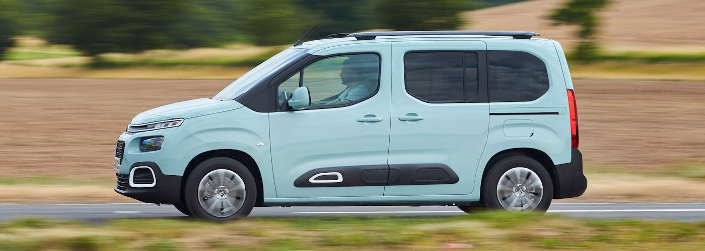 The side exterior of a blue Citroen Berlingo