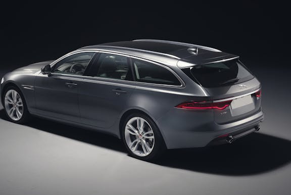 The rear exterior of a grey Jaguar XF