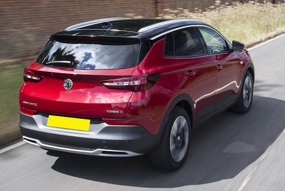 The rear exterior of a red Vauxhall Grandland X