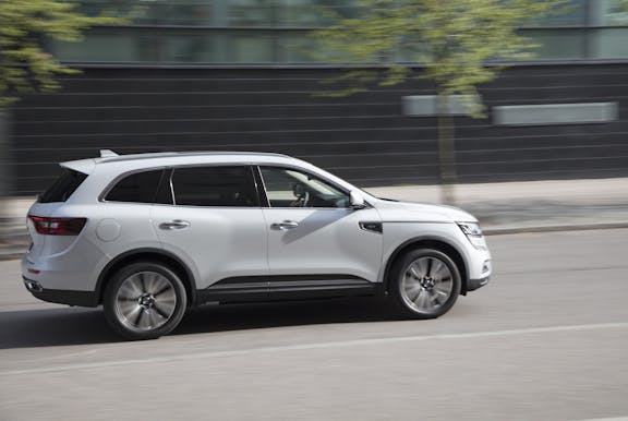 The side exterior of a white Renault Koleos