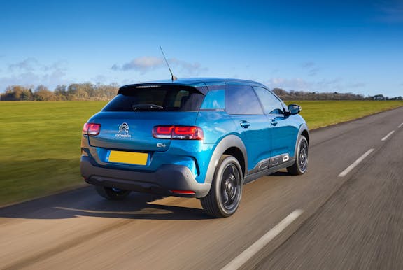 The rear exterior of a blue Citroen C4 Cactus