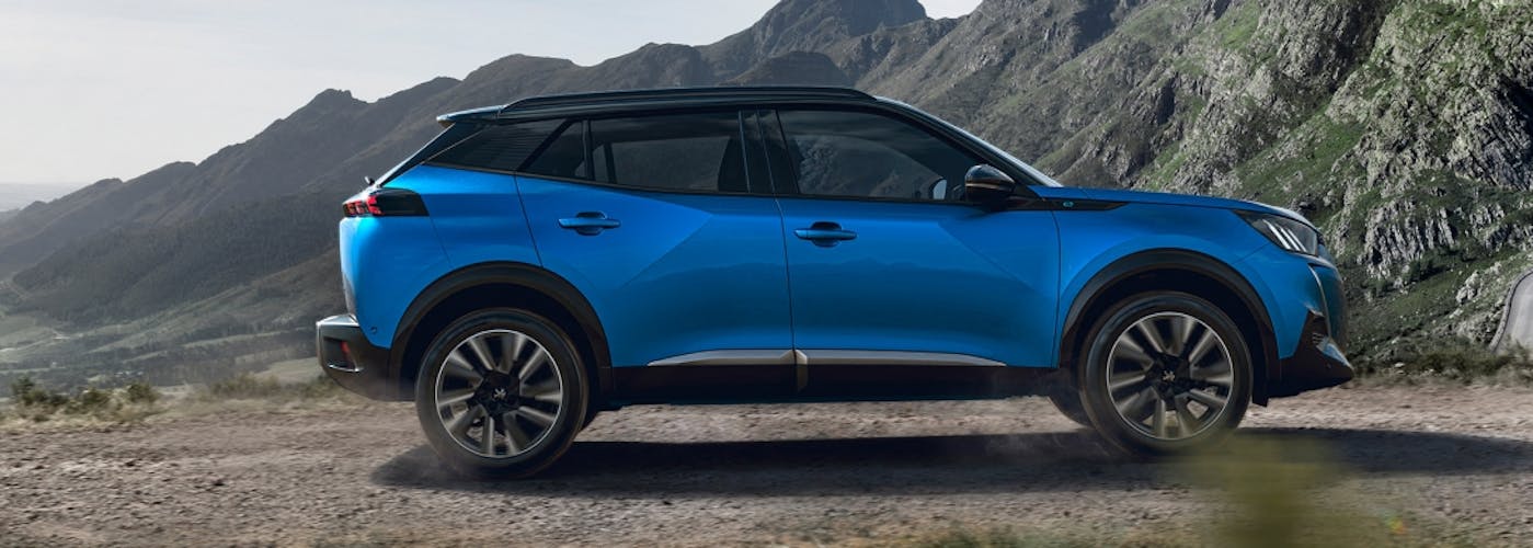 The side exterior of a blue Peugeot 2008