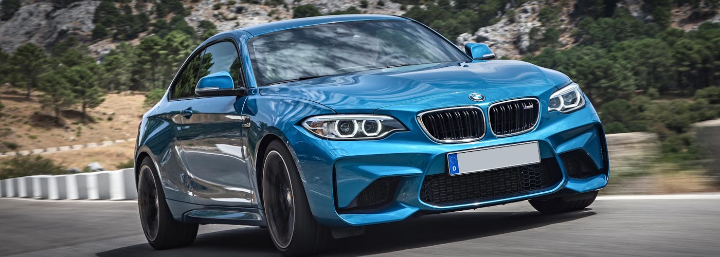 The front exterior of a blue BMW M2