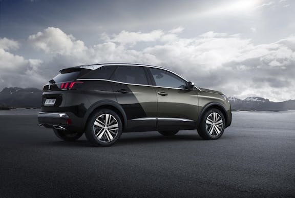 The side exterior of a black Peugeot 3008