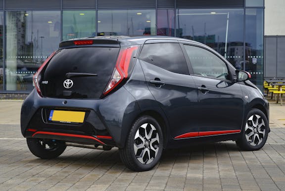 The rear exterior of a black Toyota Aygo