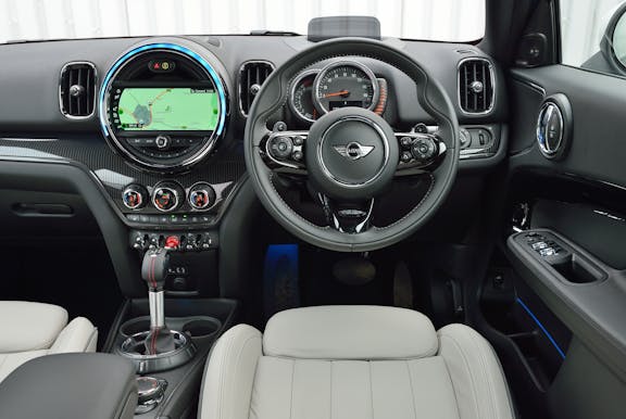 The interior of a Mini Countryman with steering wheel and dashboard in shot