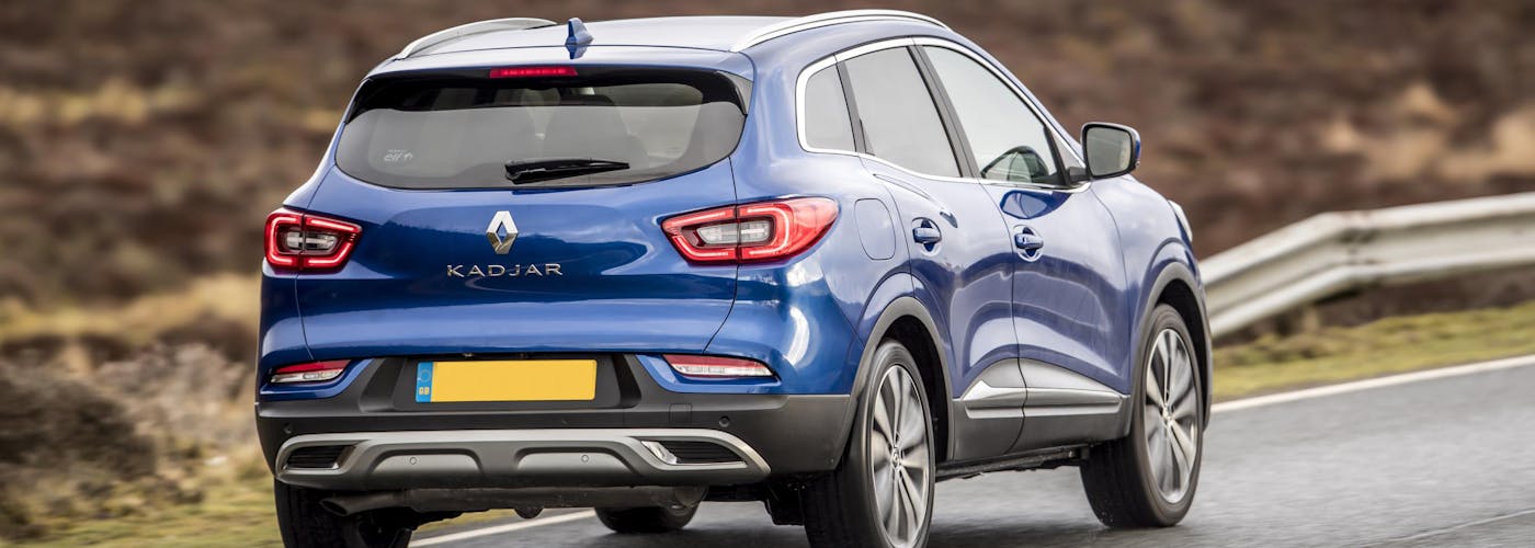 The rear exterior of a blue Renault Kadjar