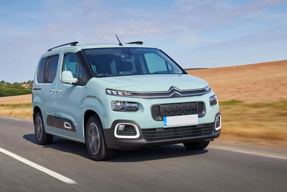 The front exterior of a blue Citroen Berlingo