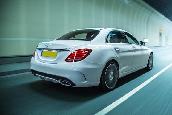 The rear exterior of a white Mercedes-Benz C-Class