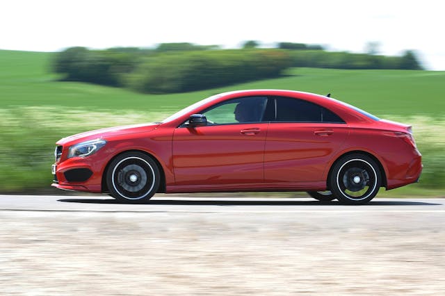 The side exterior of a red Mercedes-Benz CLA