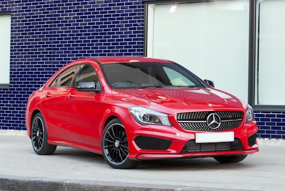 The front exterior of a red Mercedes-Benz CLA