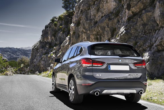 The rear exterior of a silver BMW X1