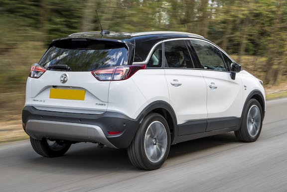 The rear exterior of a white Vauxhall Crossland X