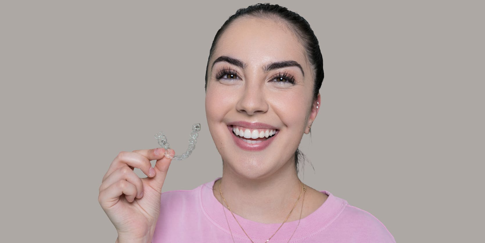 Emily from Vogue Dental Studios with her Invisalign clear aligners