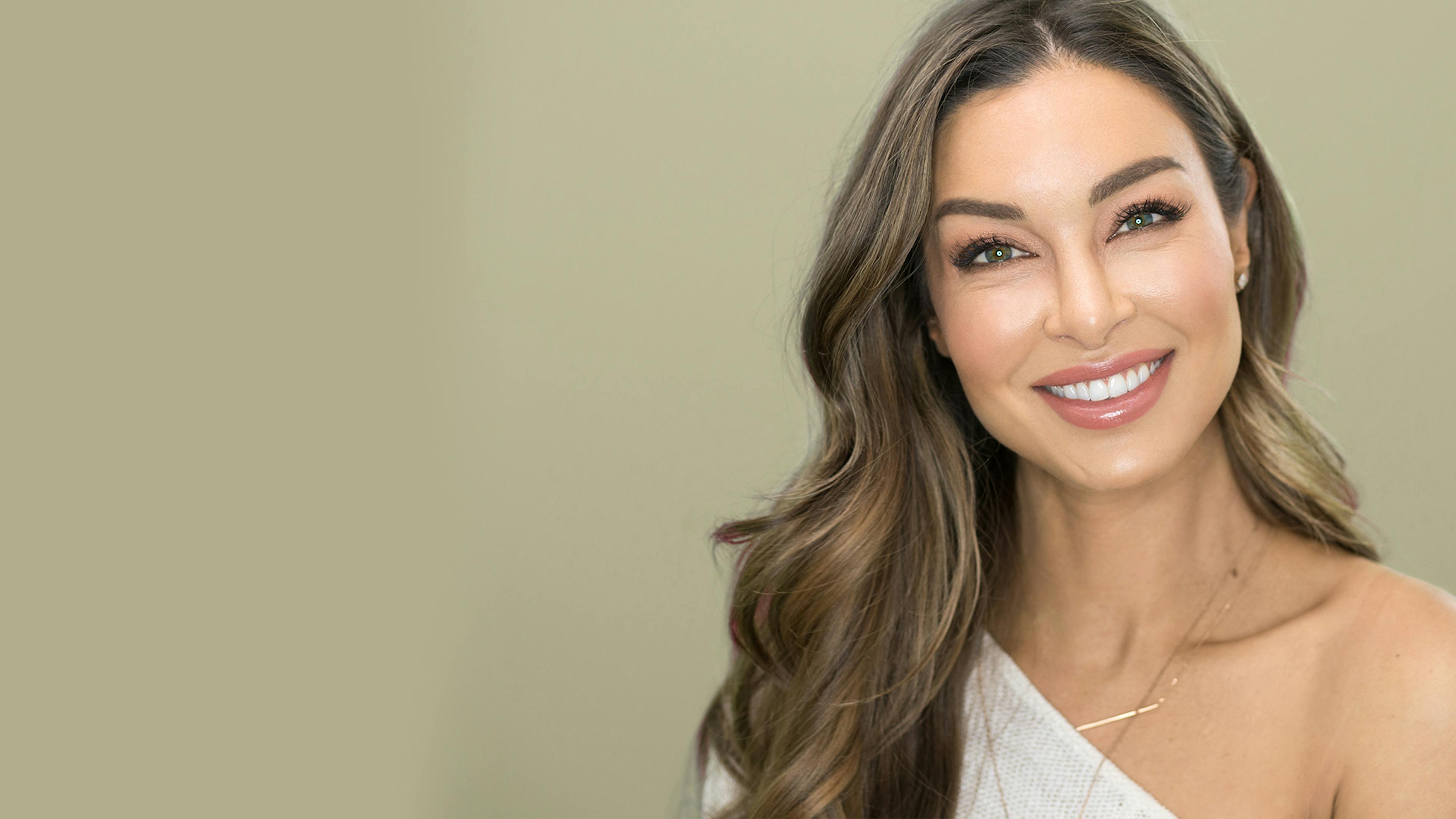 Laurina Fleure shows off her Invisalign progress after completion.