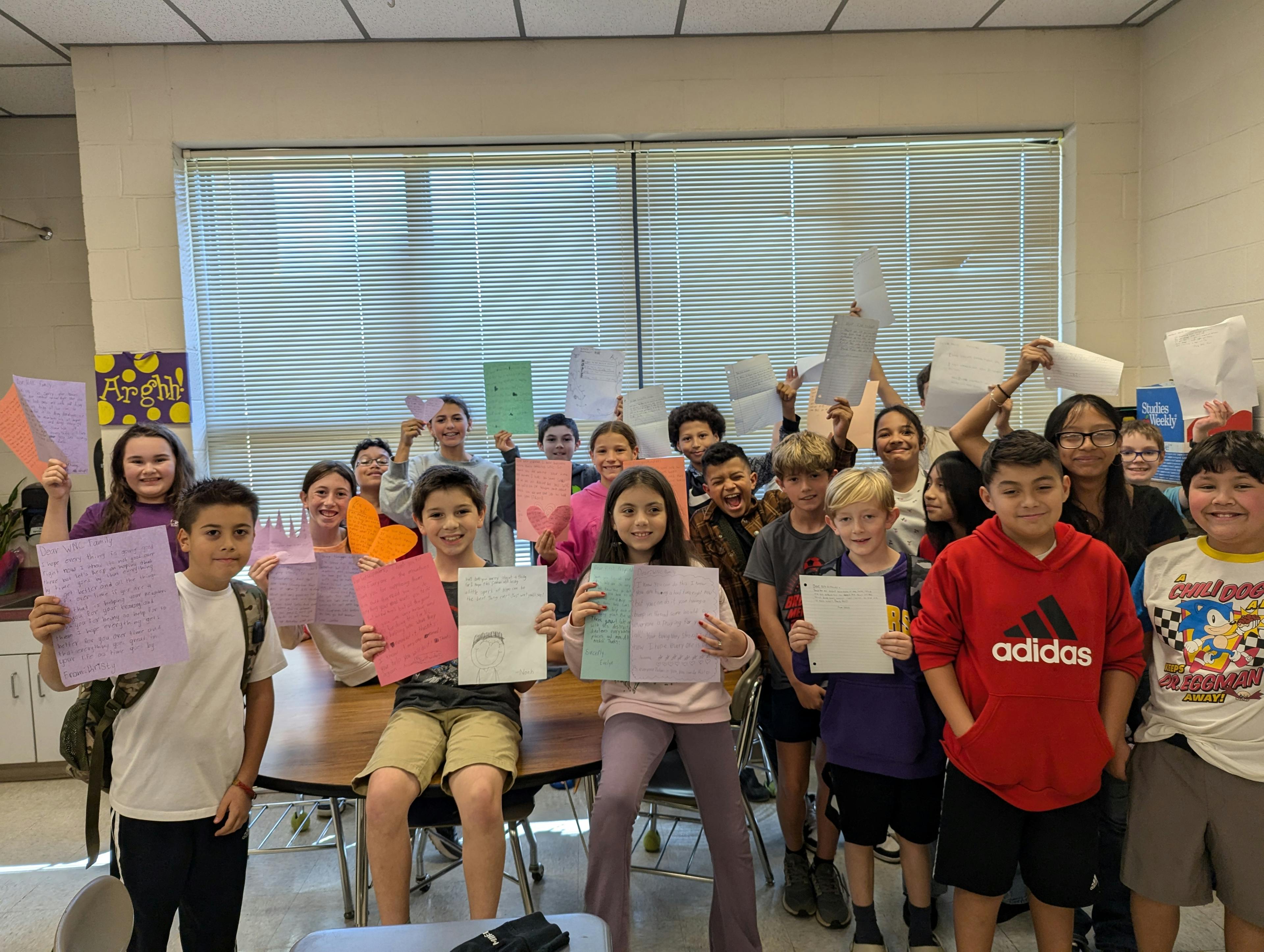 Students write letters to those impacted by Hurricane Helene.
