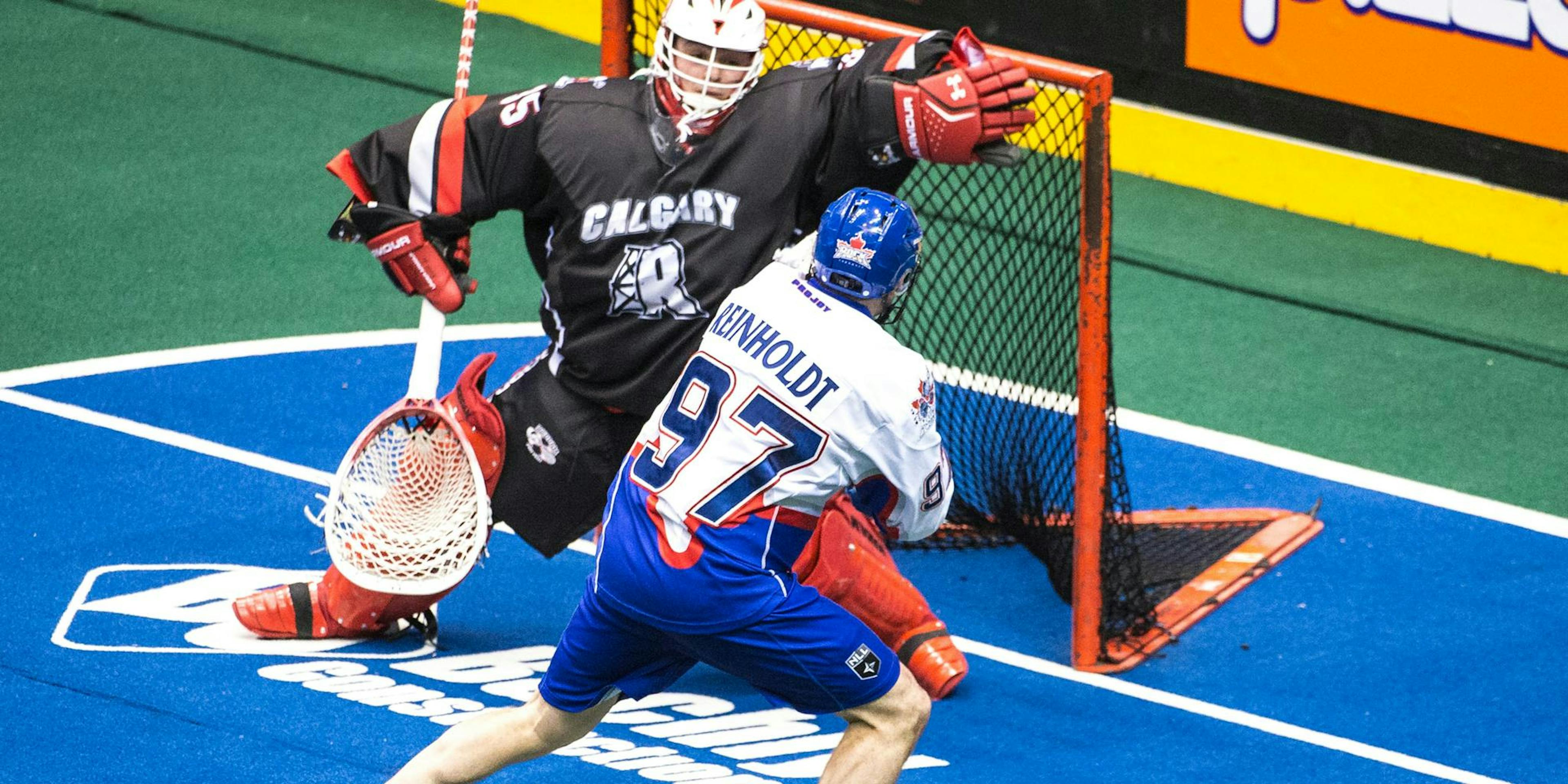 Reid Reinholdt action shot, shooting into lacrosse net