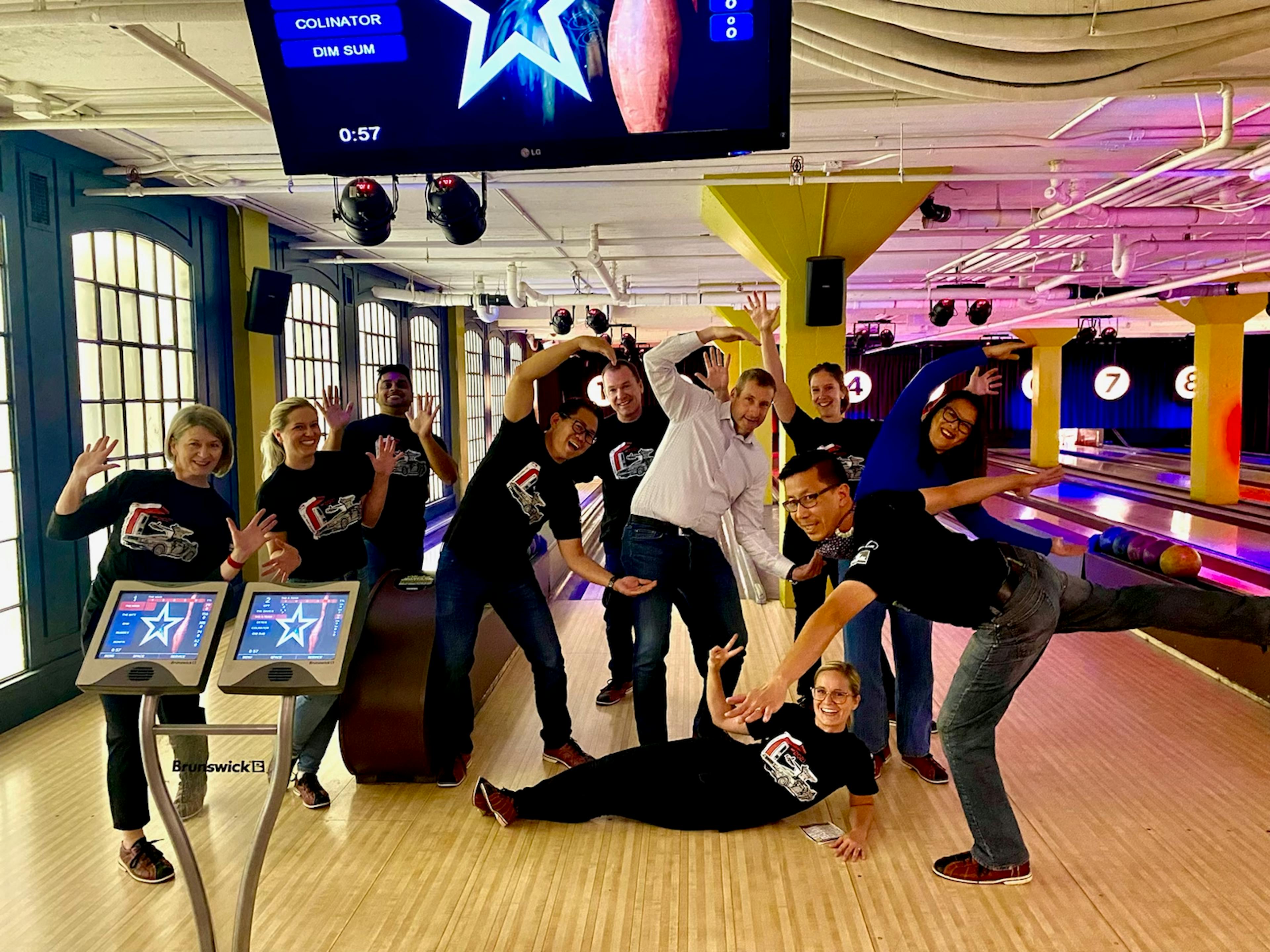 team posing at bowling