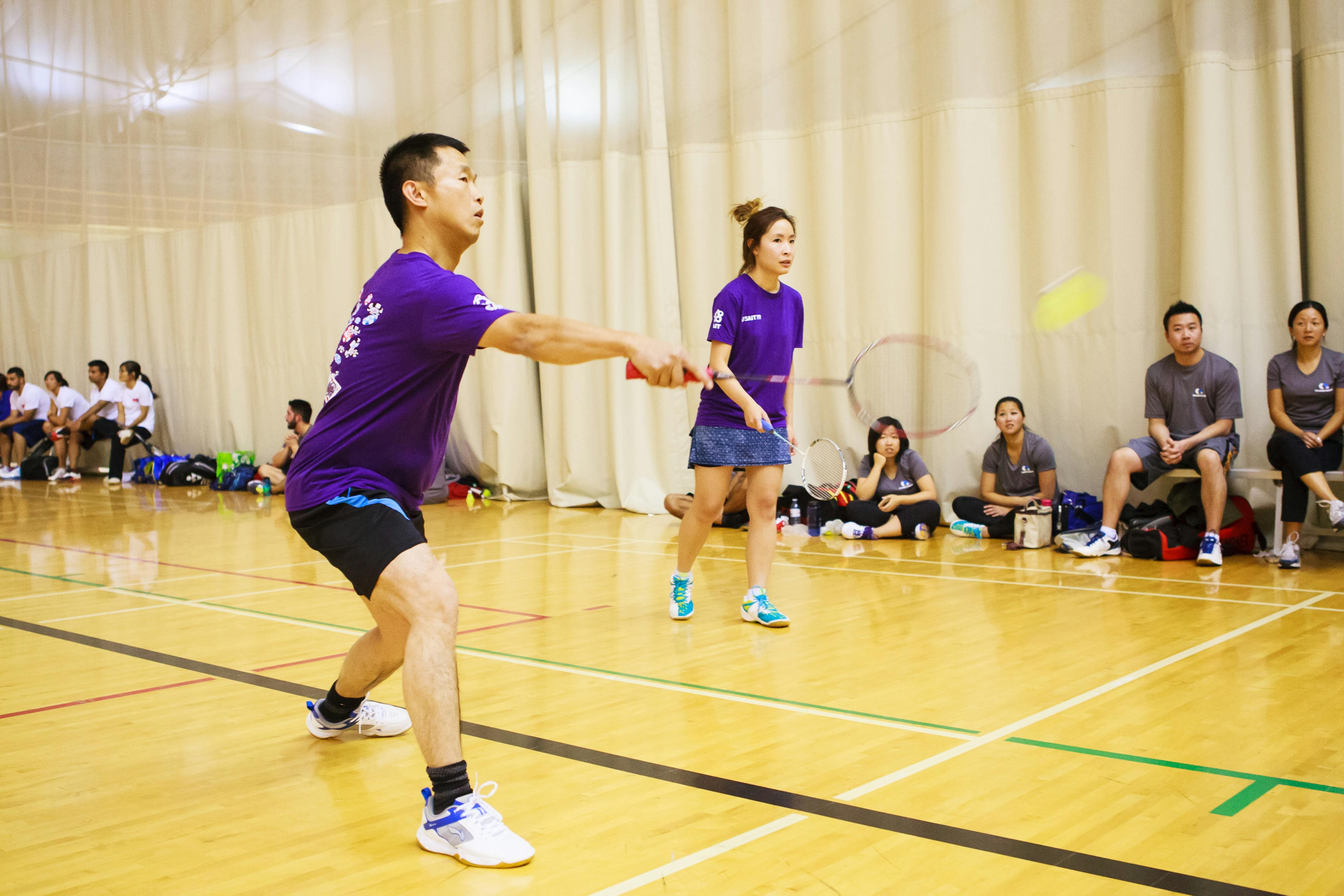 teams playing badminton