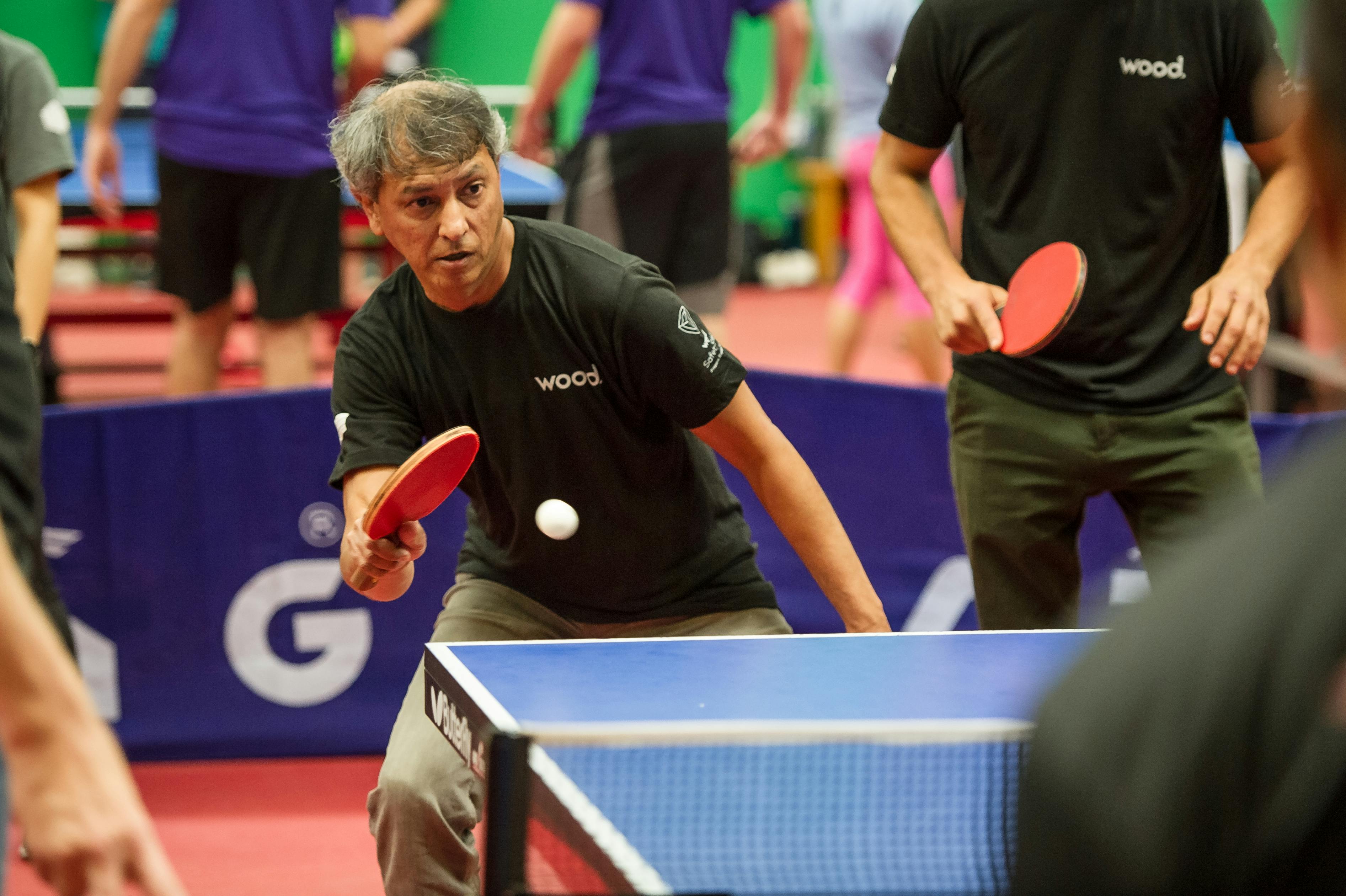 man playing table tennis