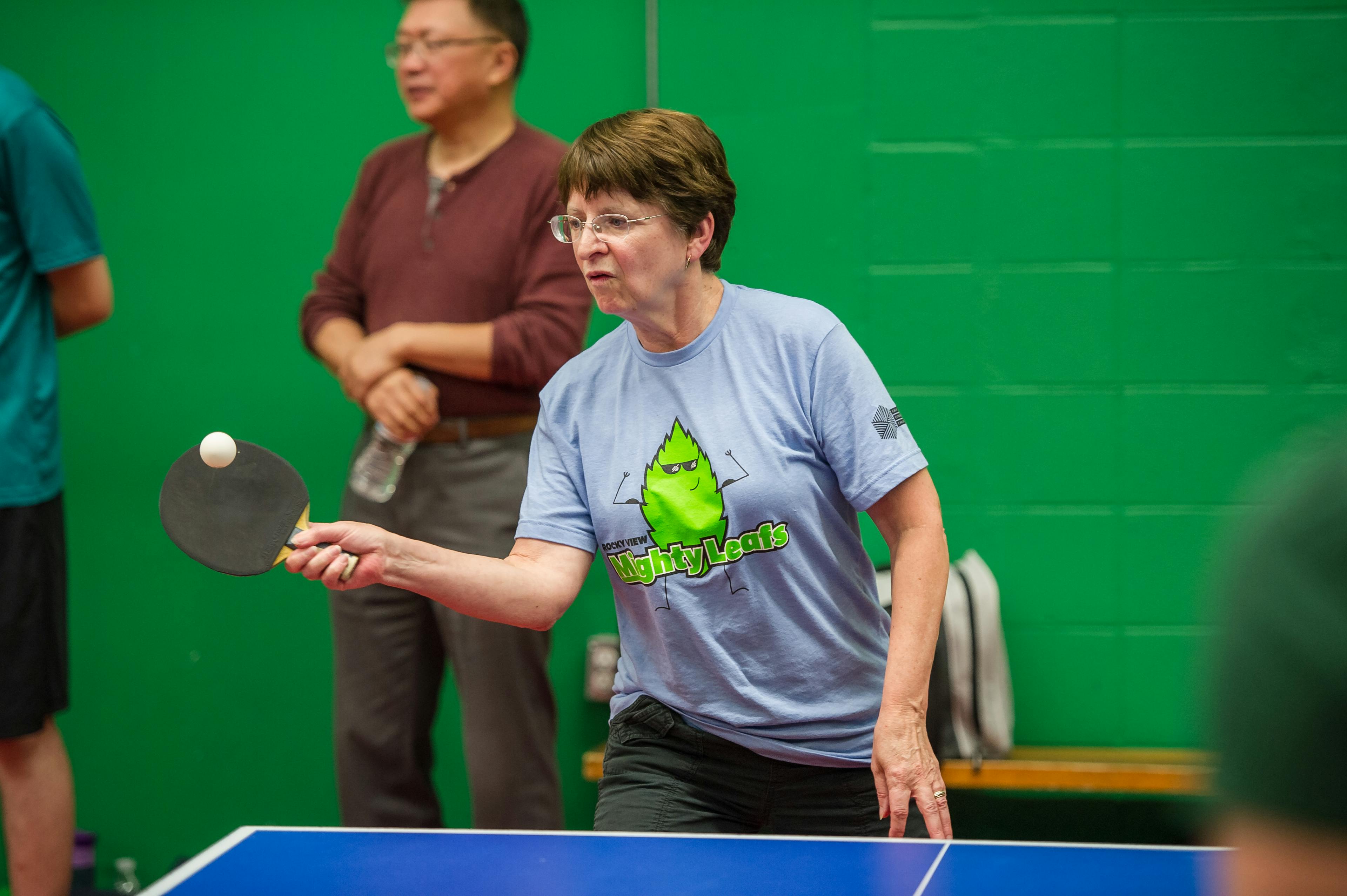 woman playing table tennis
