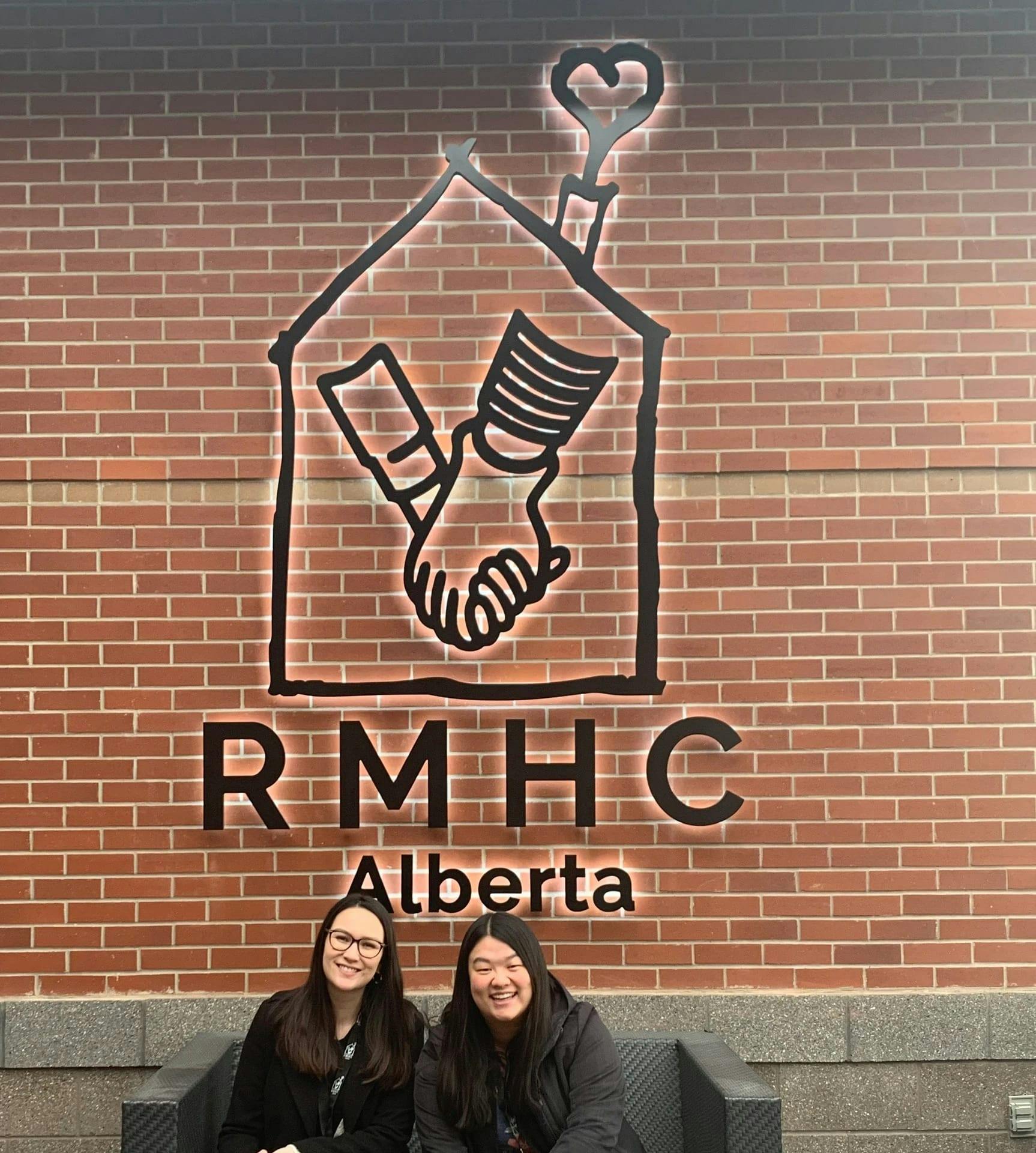 CCC team members Hayley and Jacquie outside the RMHC sign