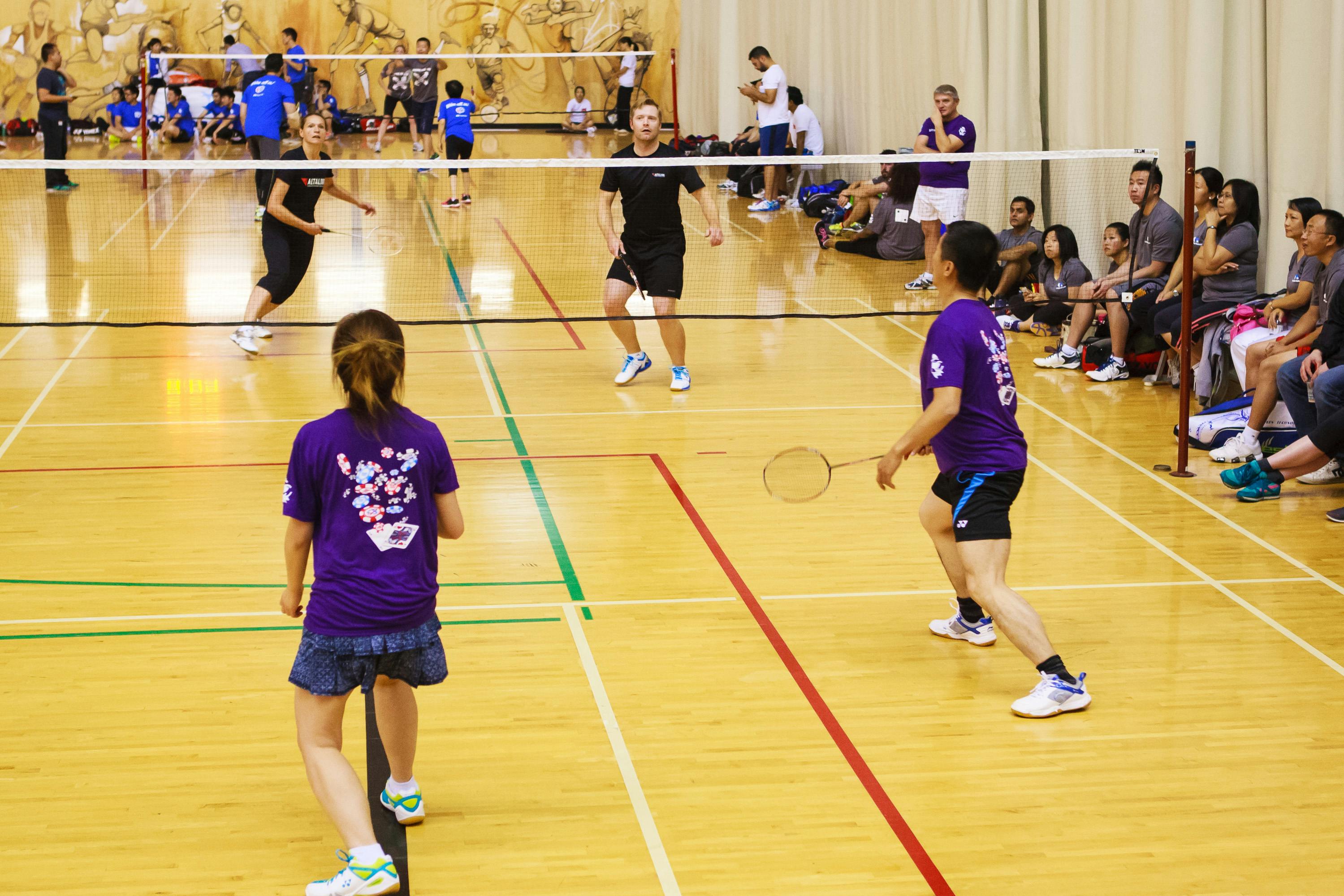 teams playing badminton