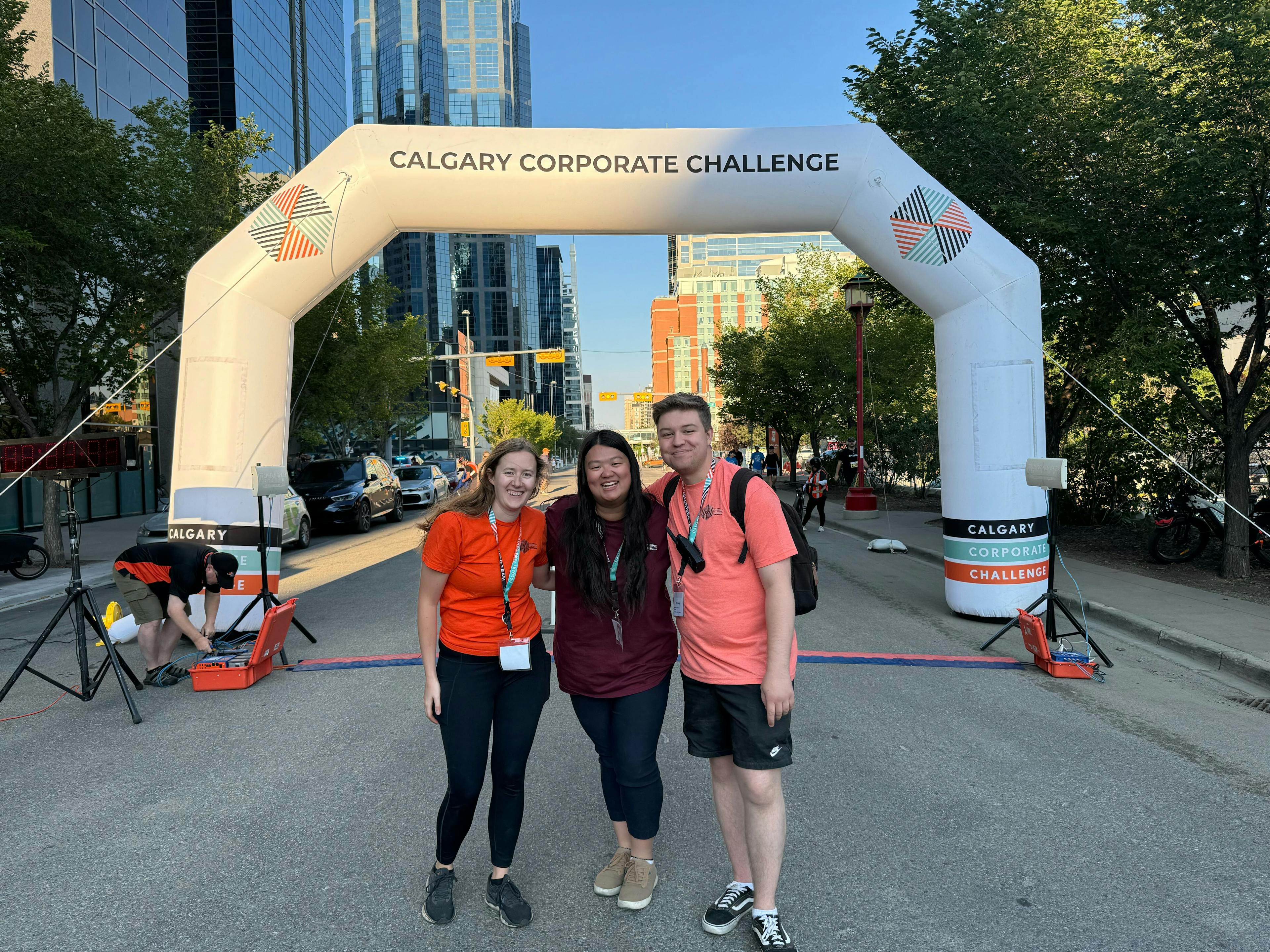 morgyn, jacquie, and trent in front of the ccc race arch