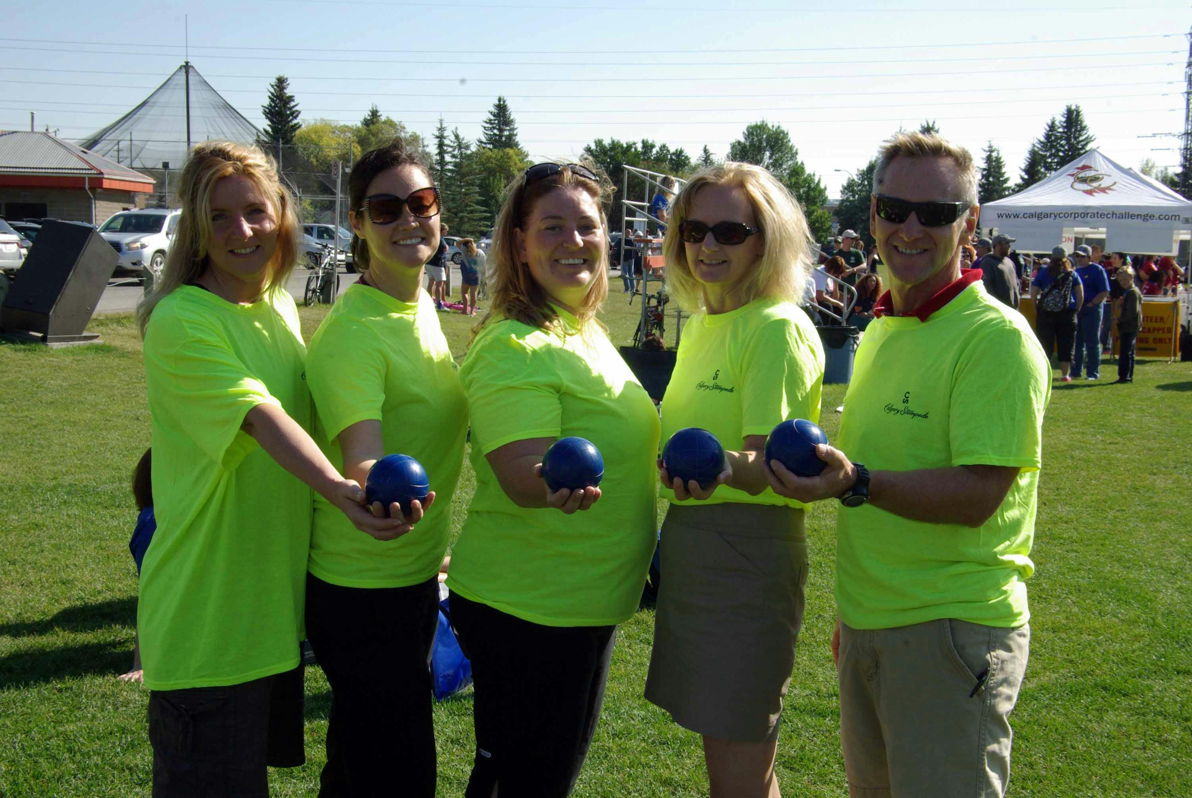 A group holding bocce balls