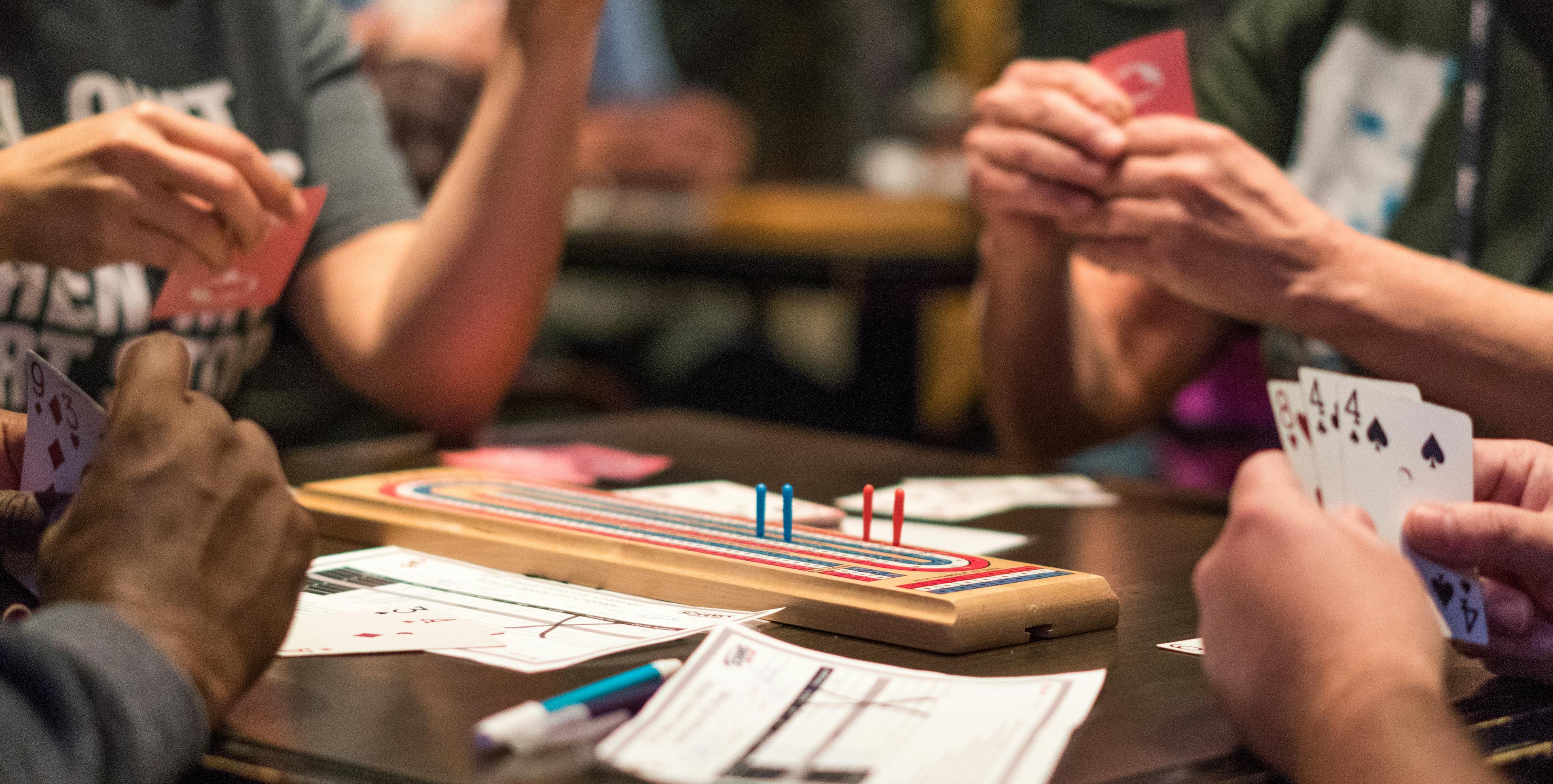 hands of cards playing cribbage