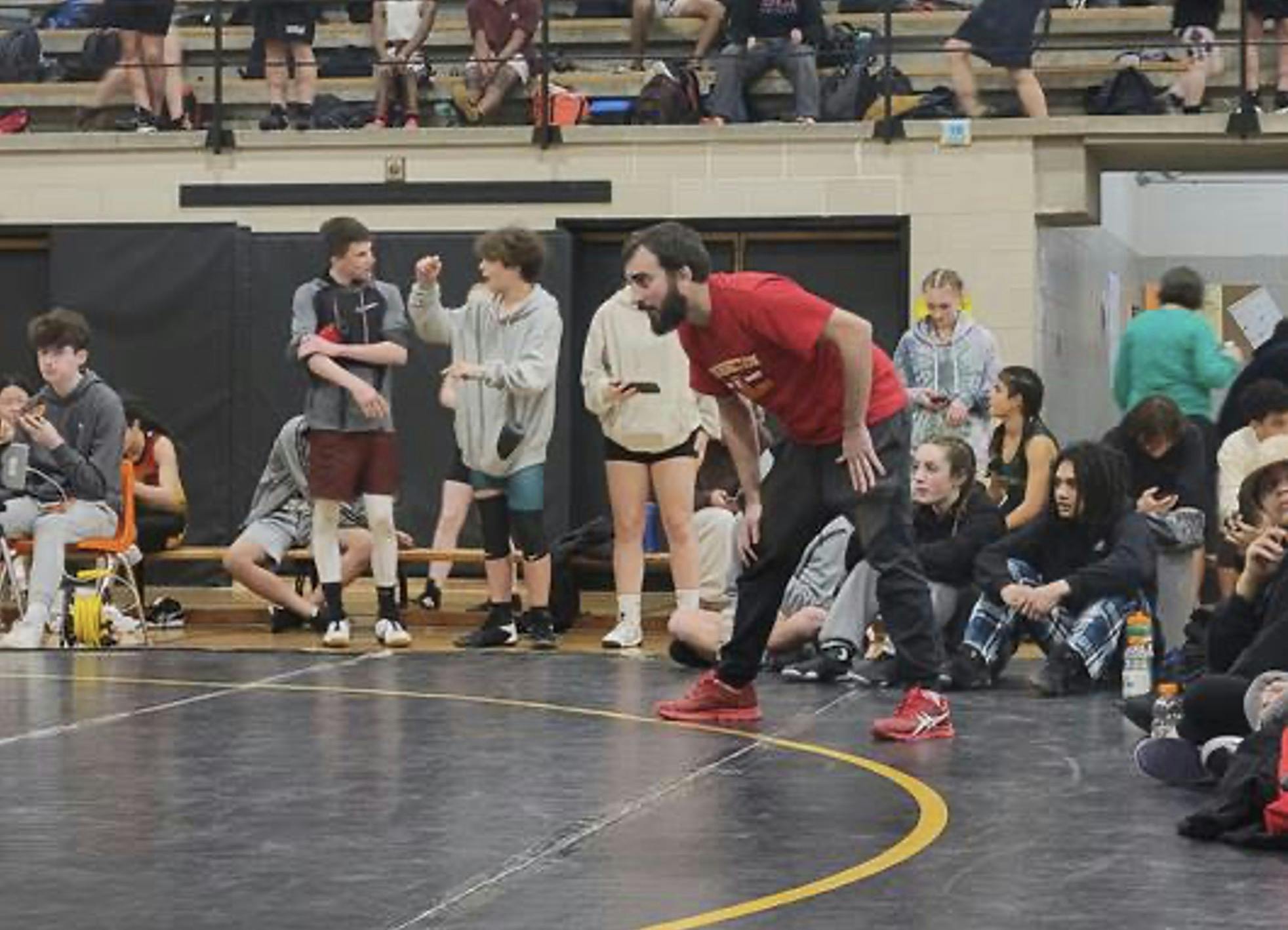 Resurrection wrestling coach Steve Gross at District 8 Championships, 2023