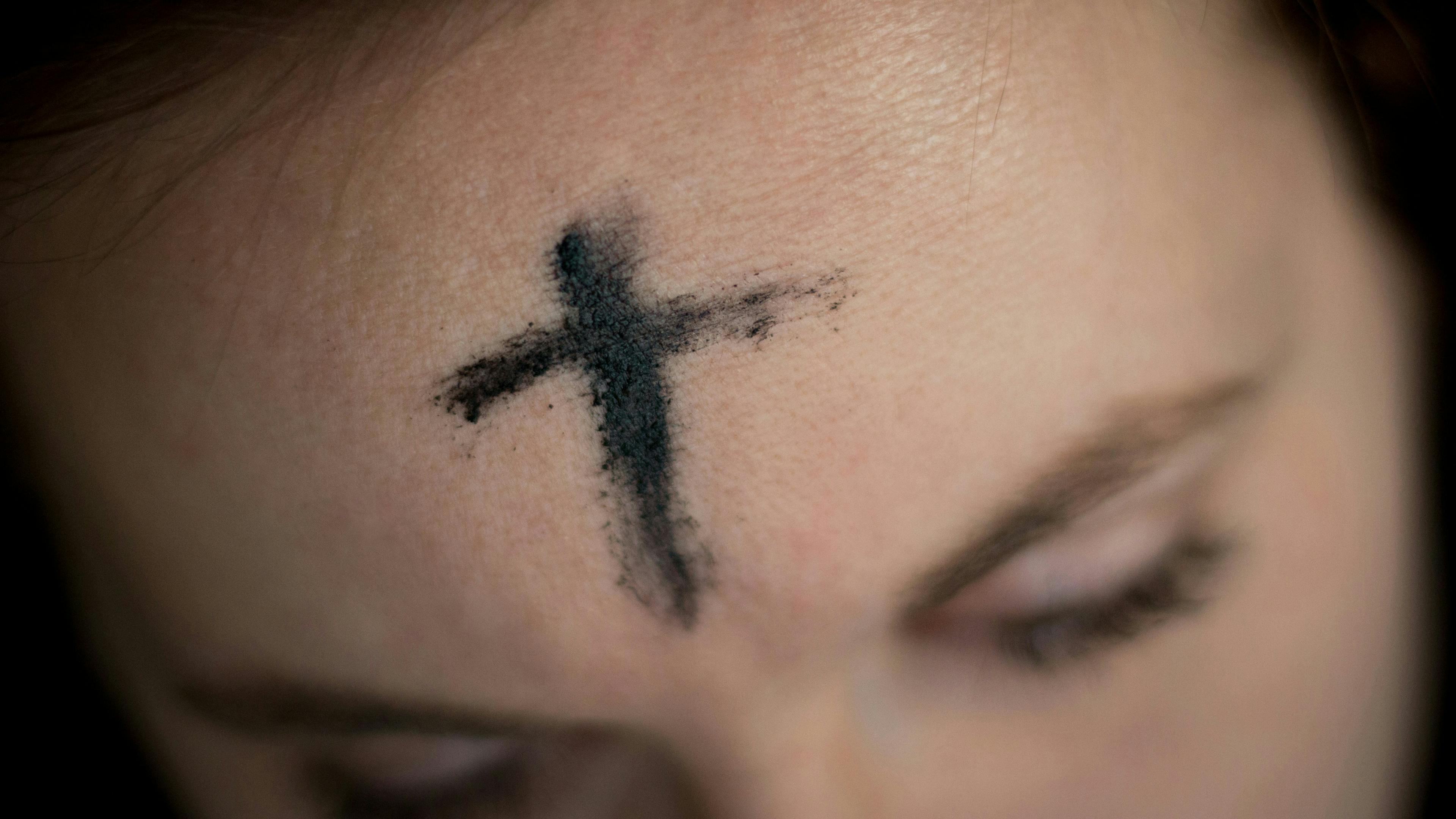 Ash cross on forehead