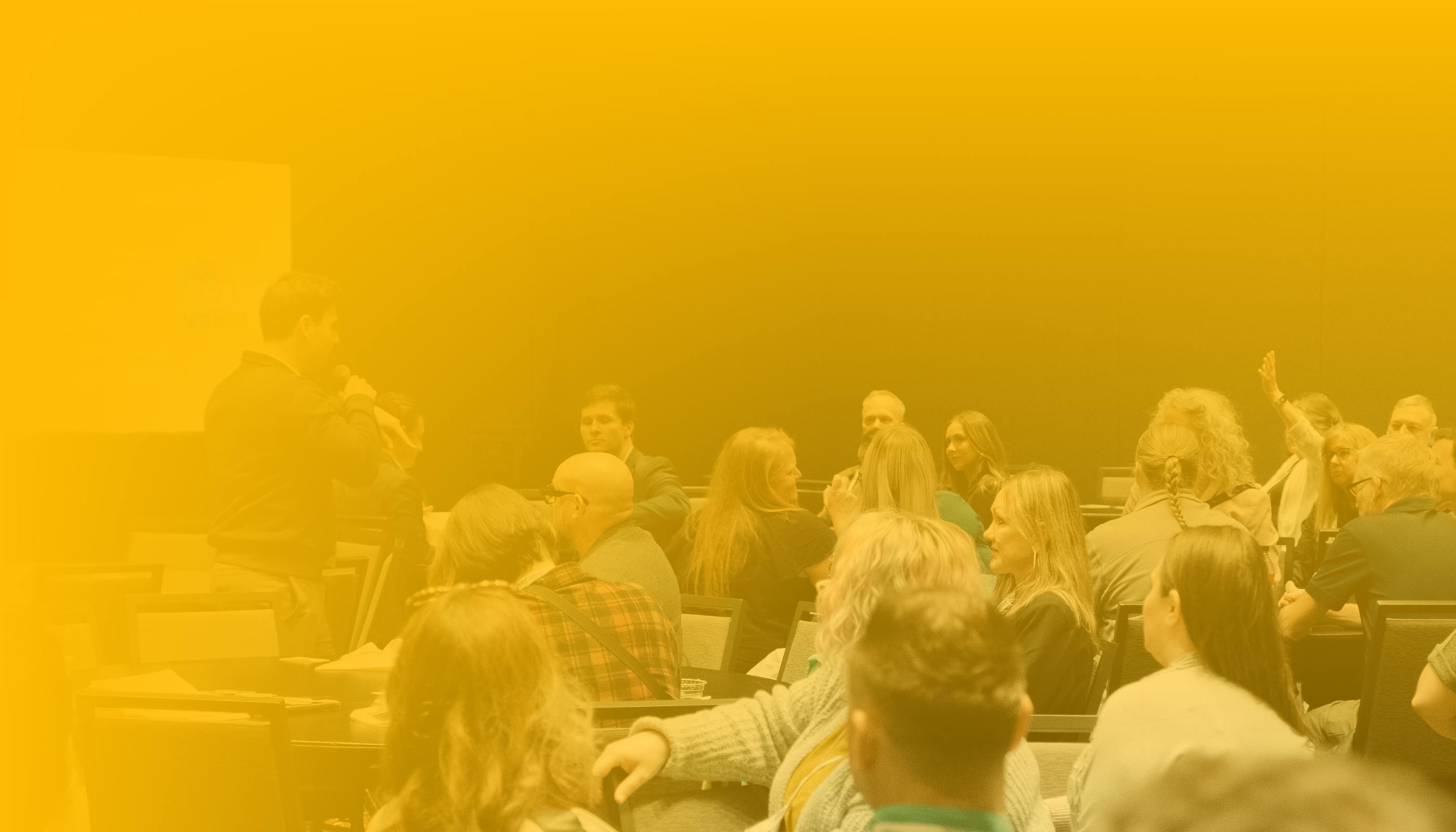 California charter school leaders together at an event, sharing best practices. 