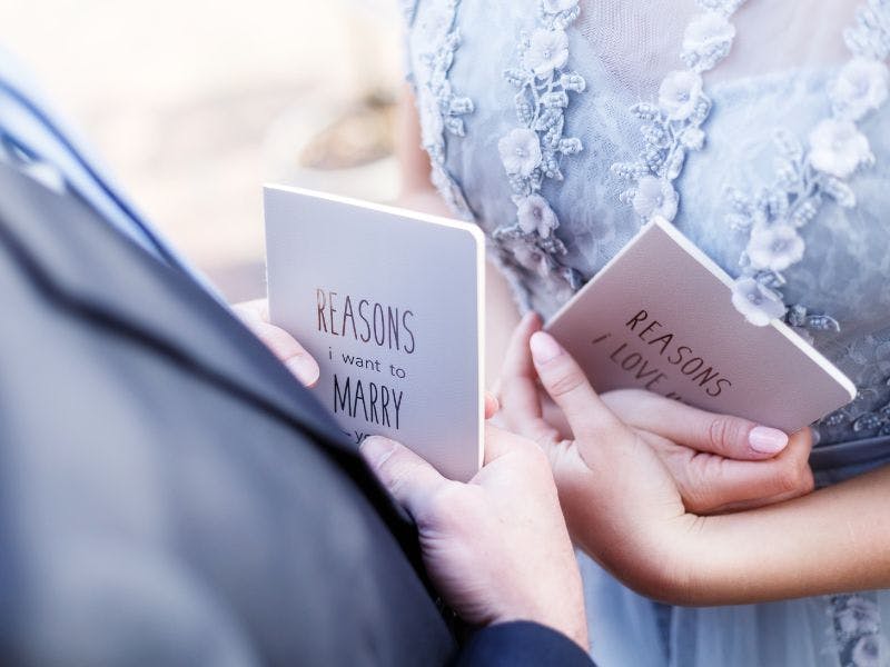 two people standing with reasons i want to marry you card