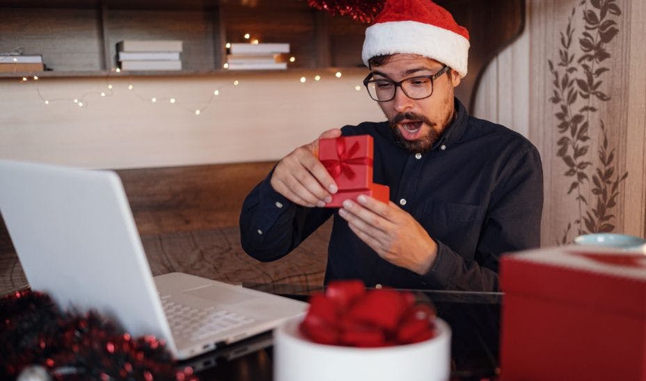 remote employee opening a christmas present