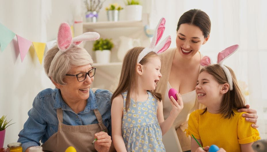 Family celebrating Easter with easter eggs