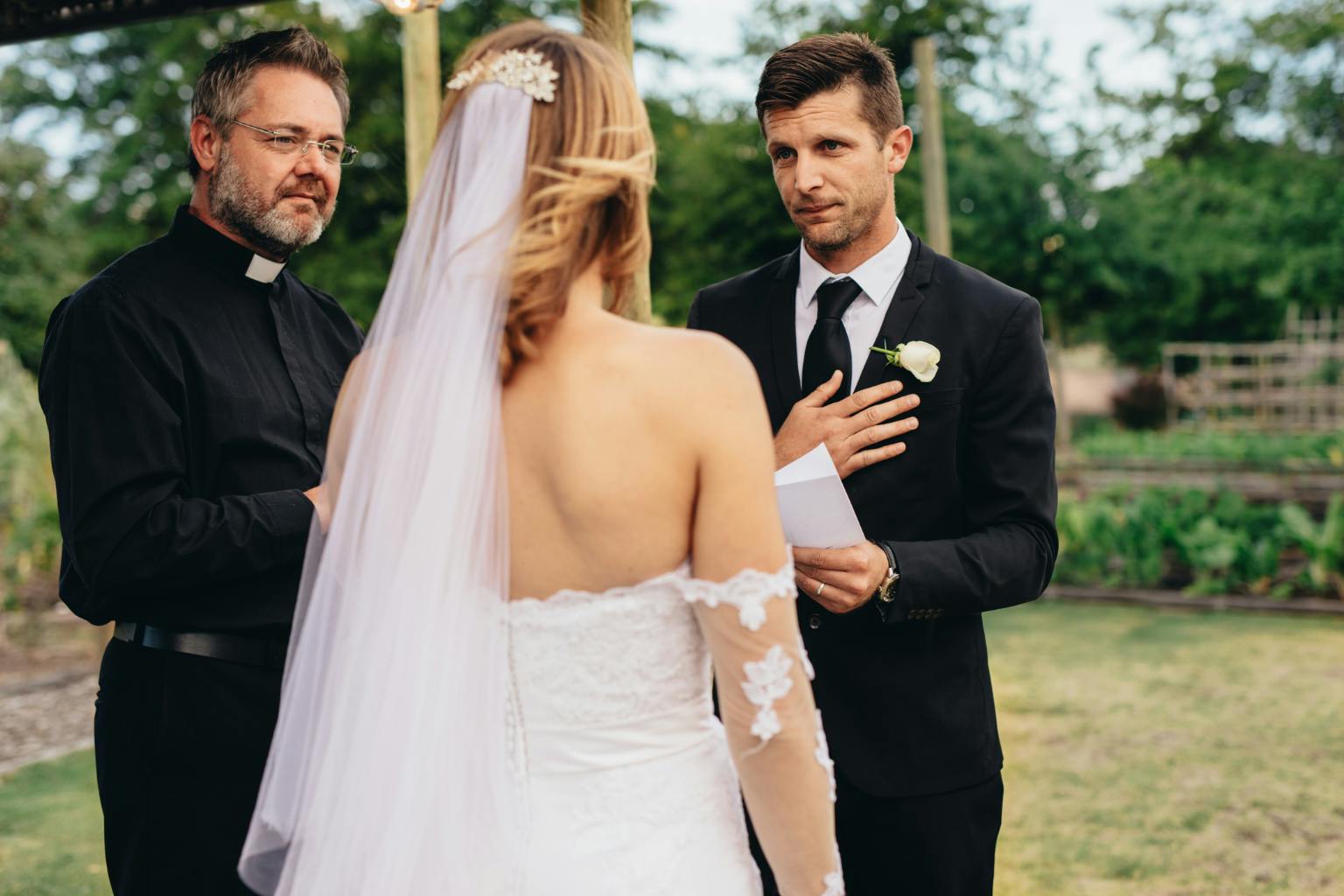Couple reading wedding vows