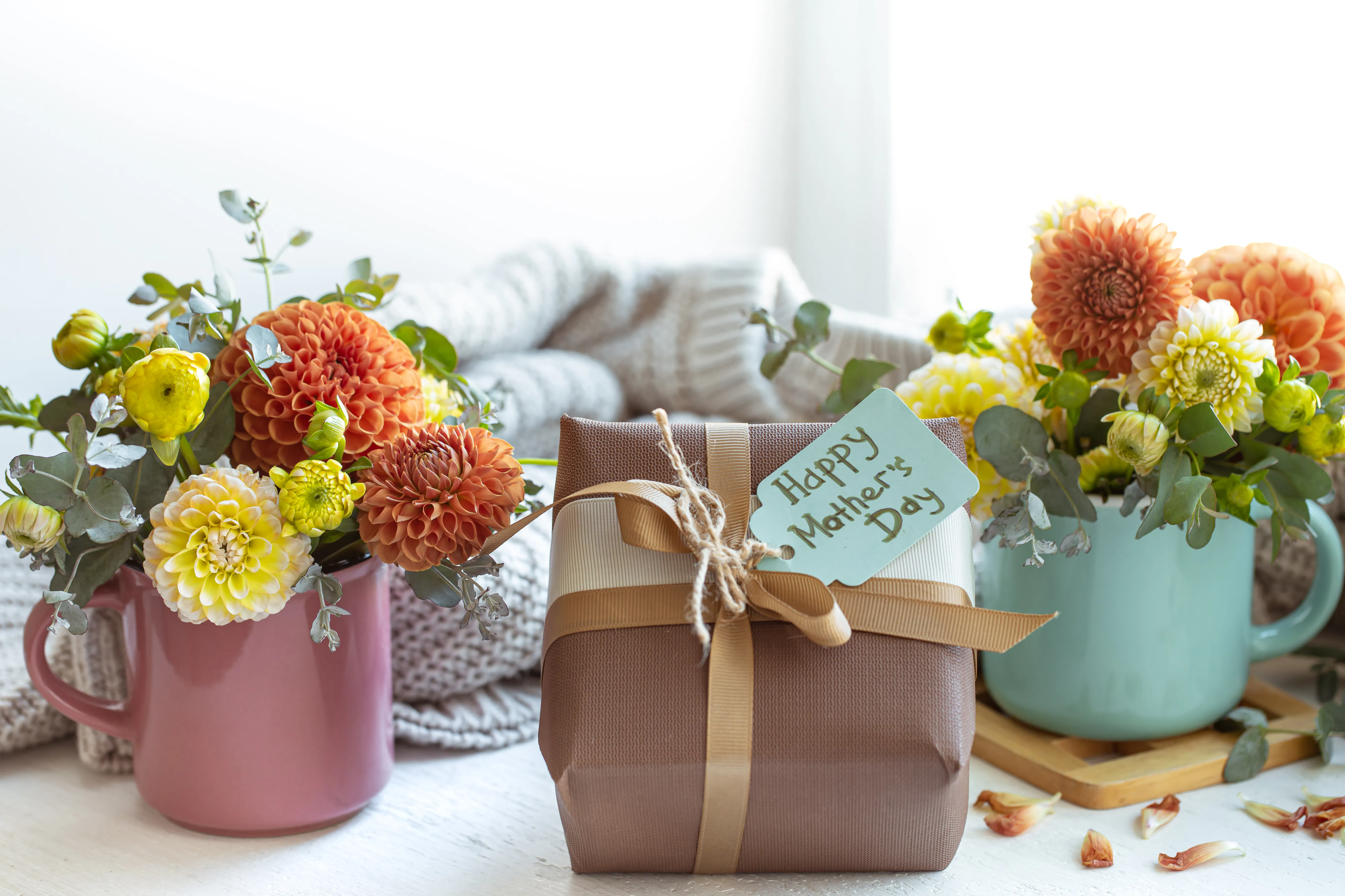 Personalised gift being kept with some decorations nearby for mother's day