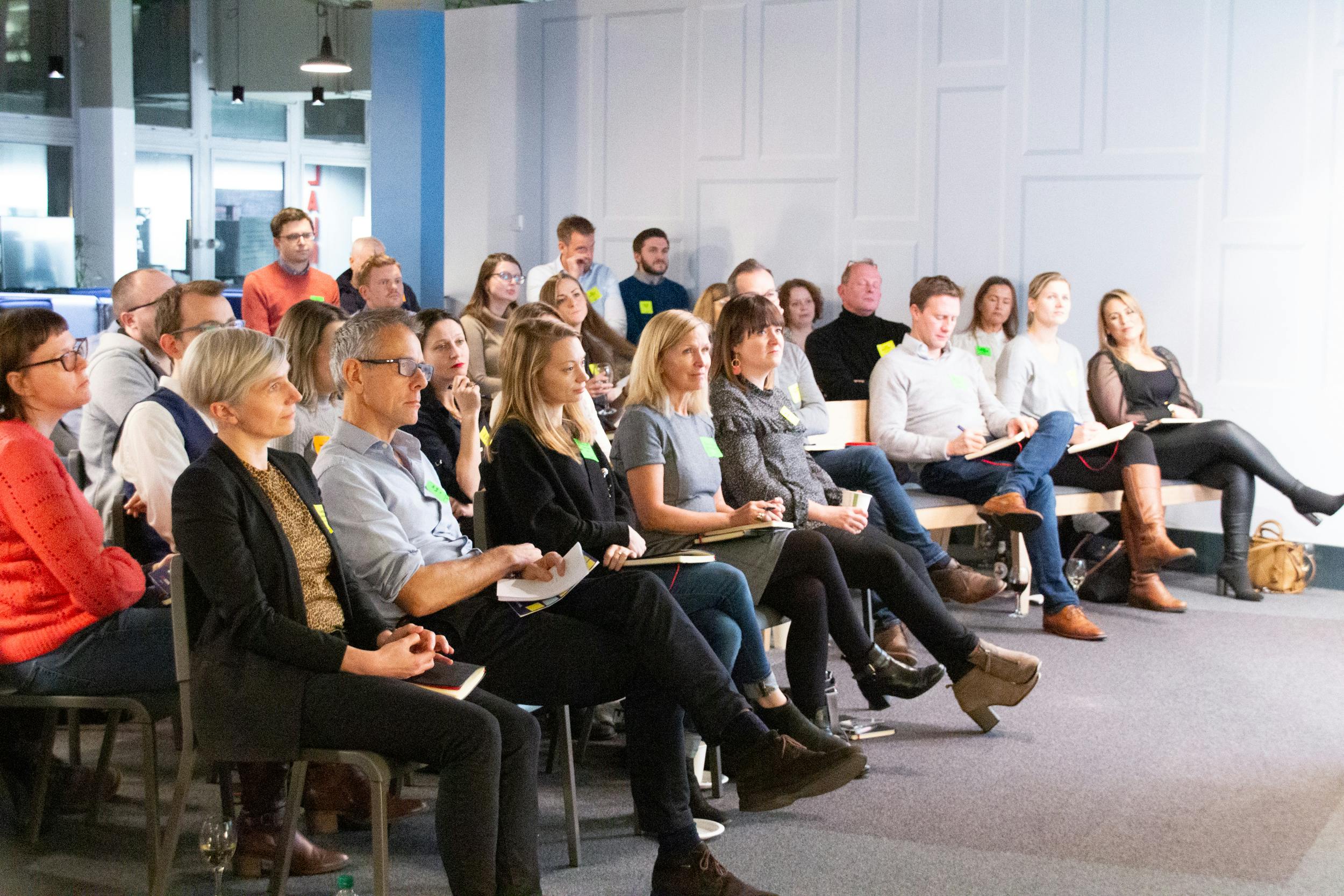 Attendees watching the presentations