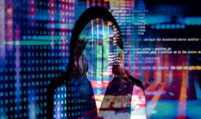 Code projected over woman