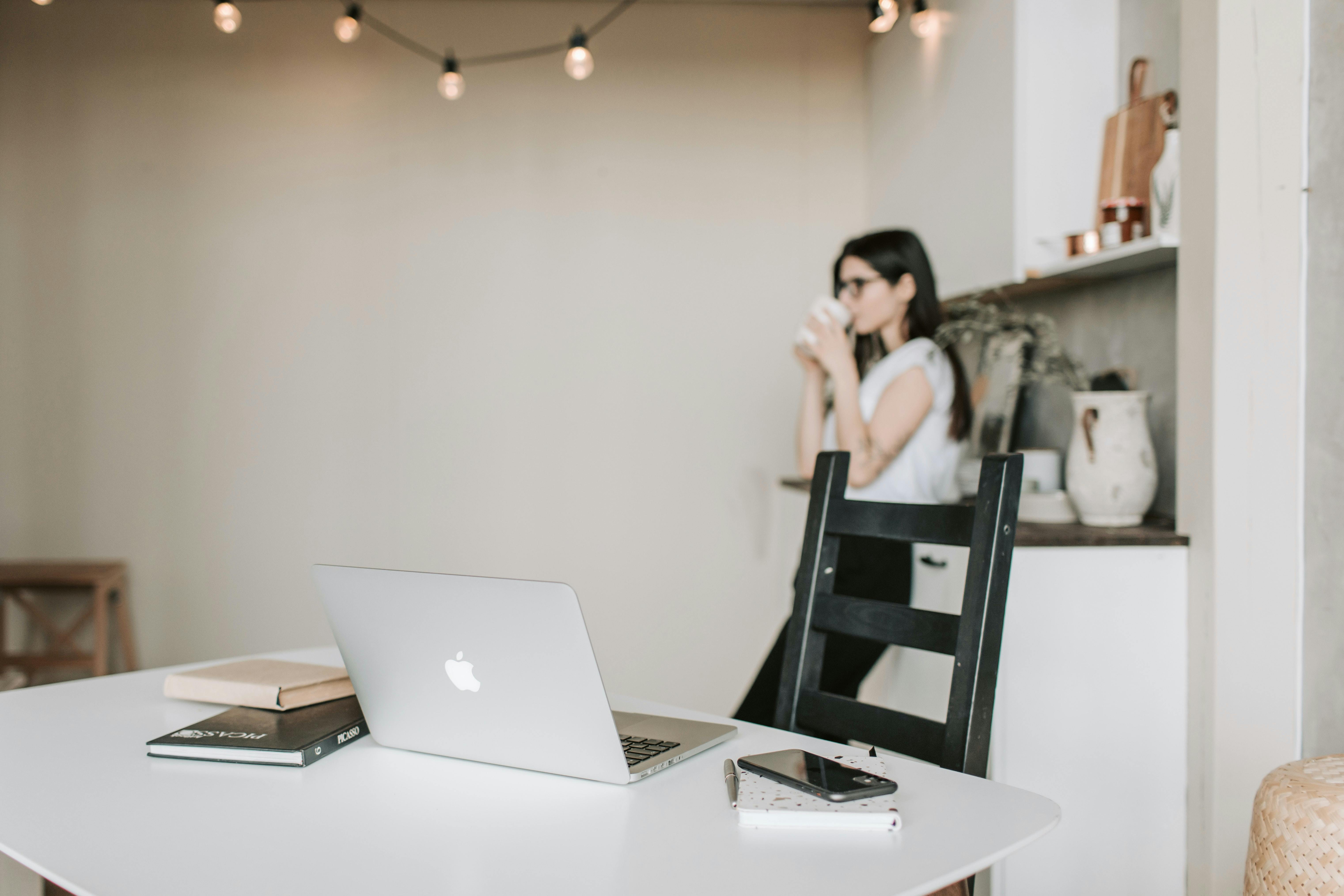 Woman drinking tea at work