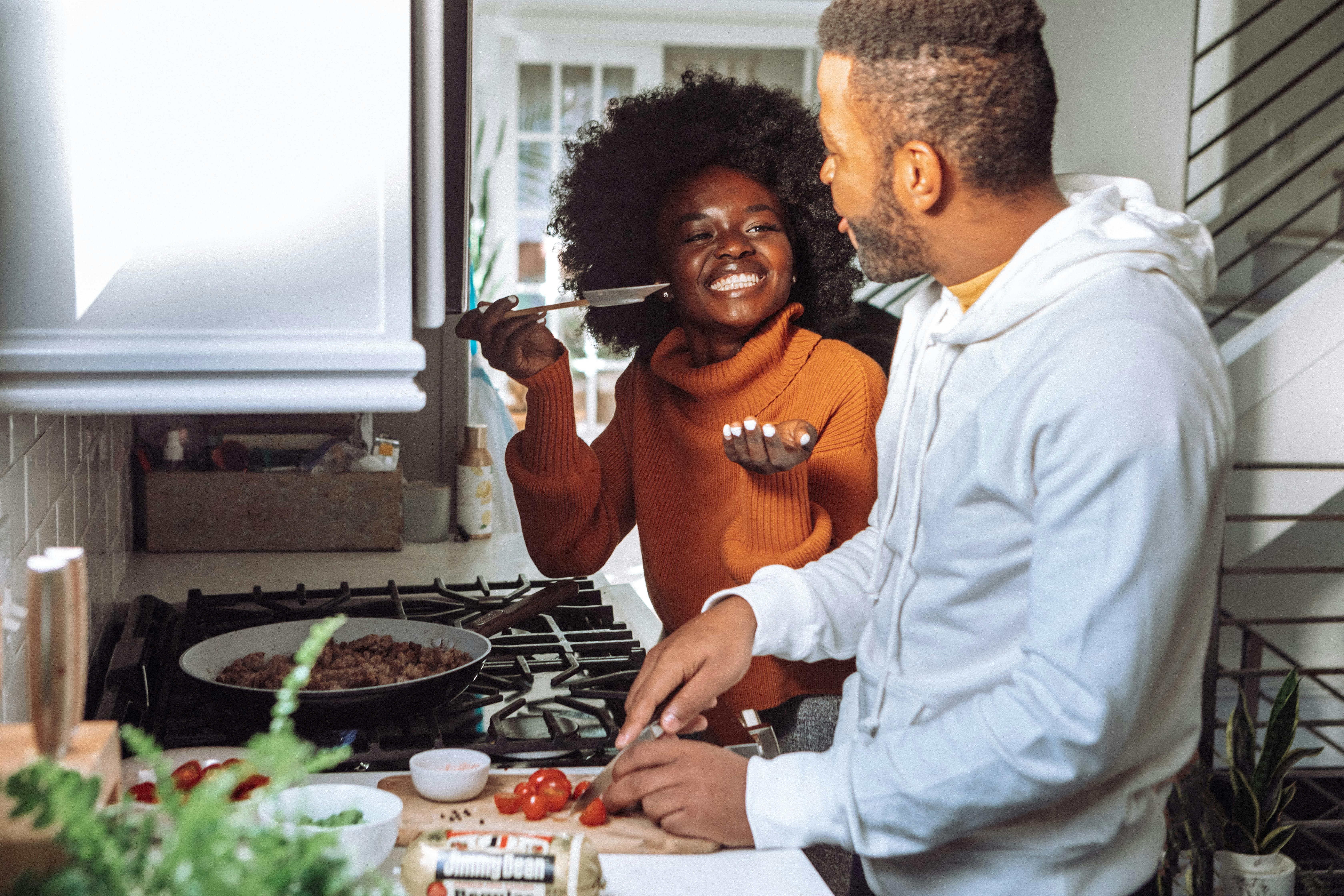 Man and woman cooking at home