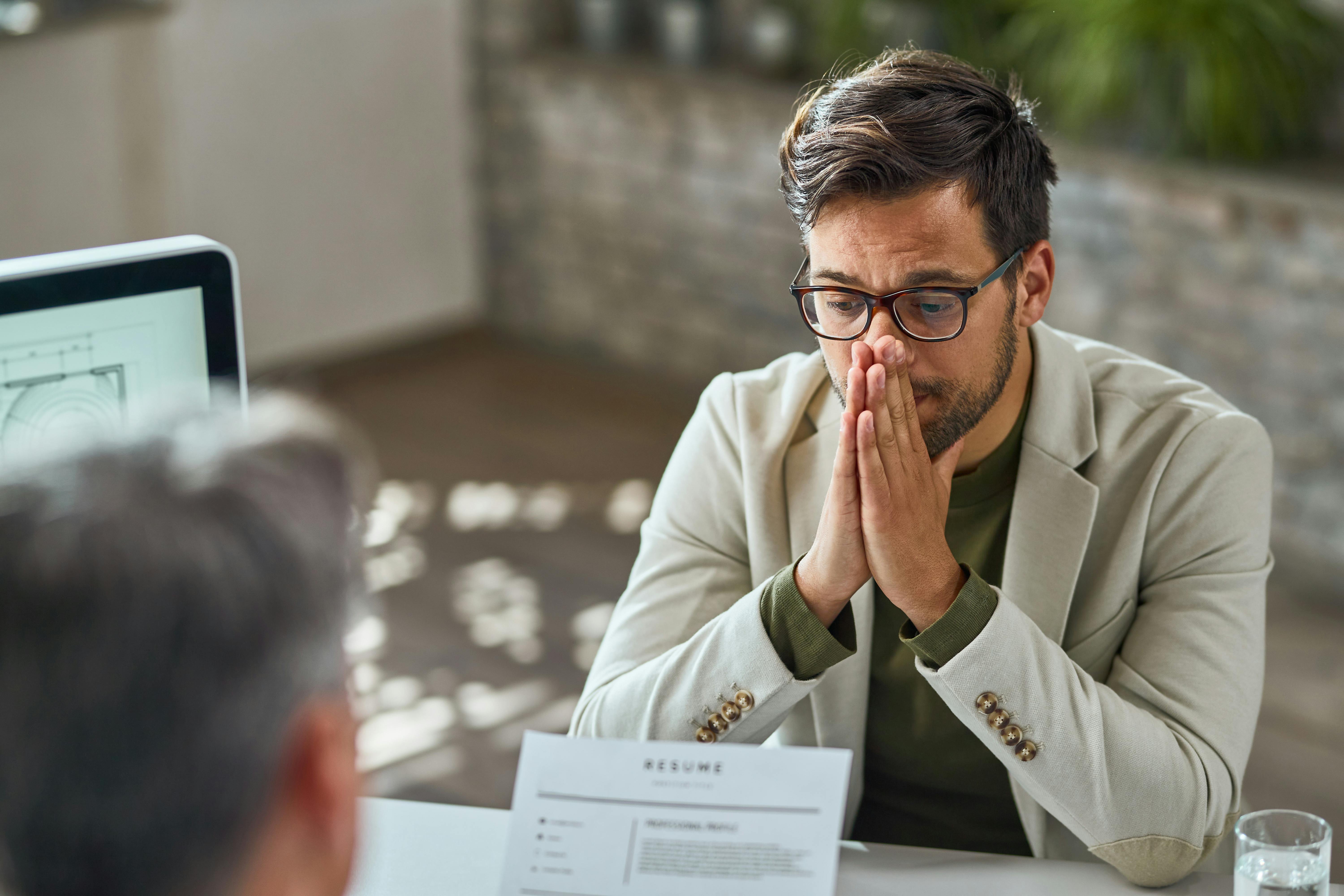 White man looks anxious during a job interview