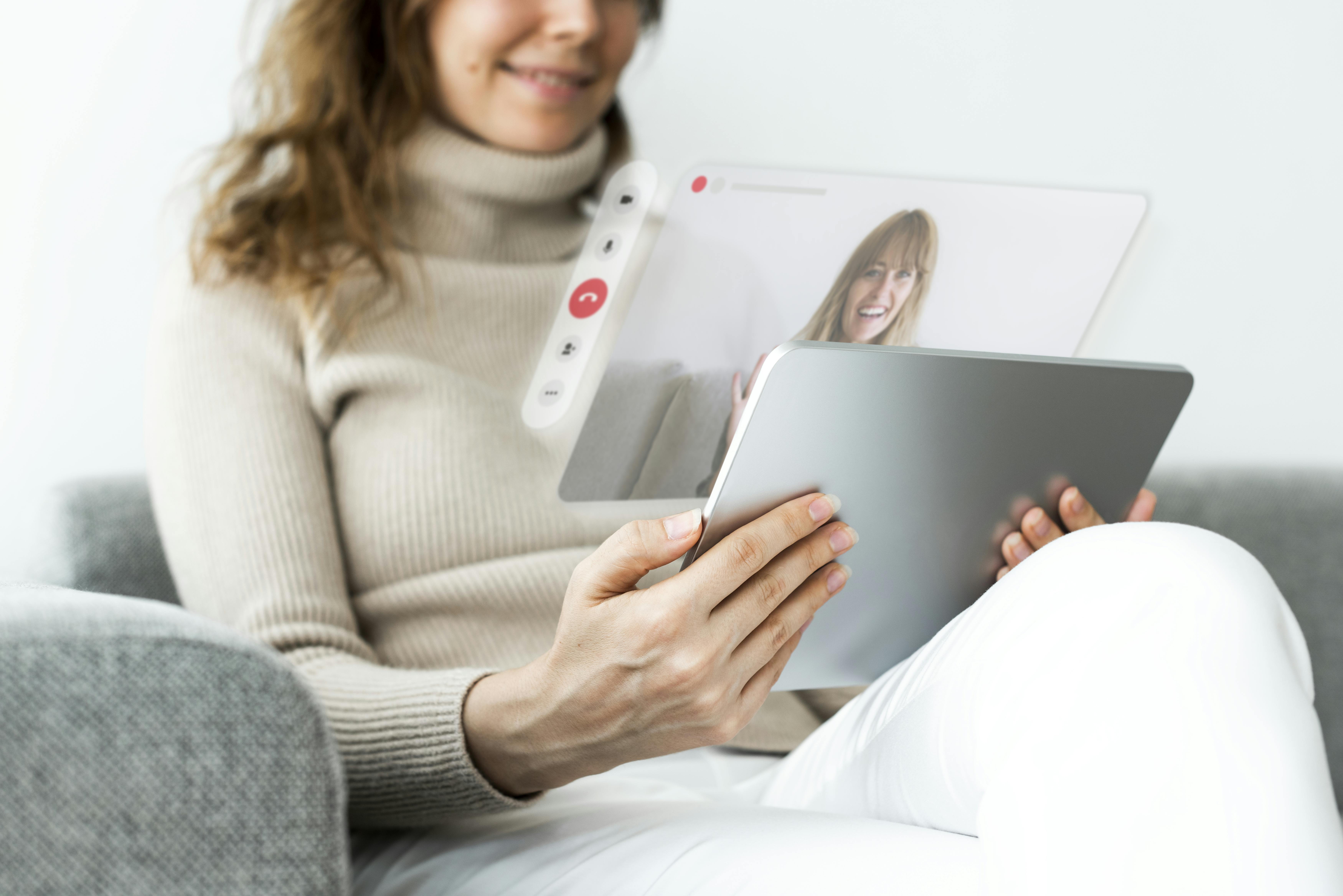 Female patient video chats with female mental health professional