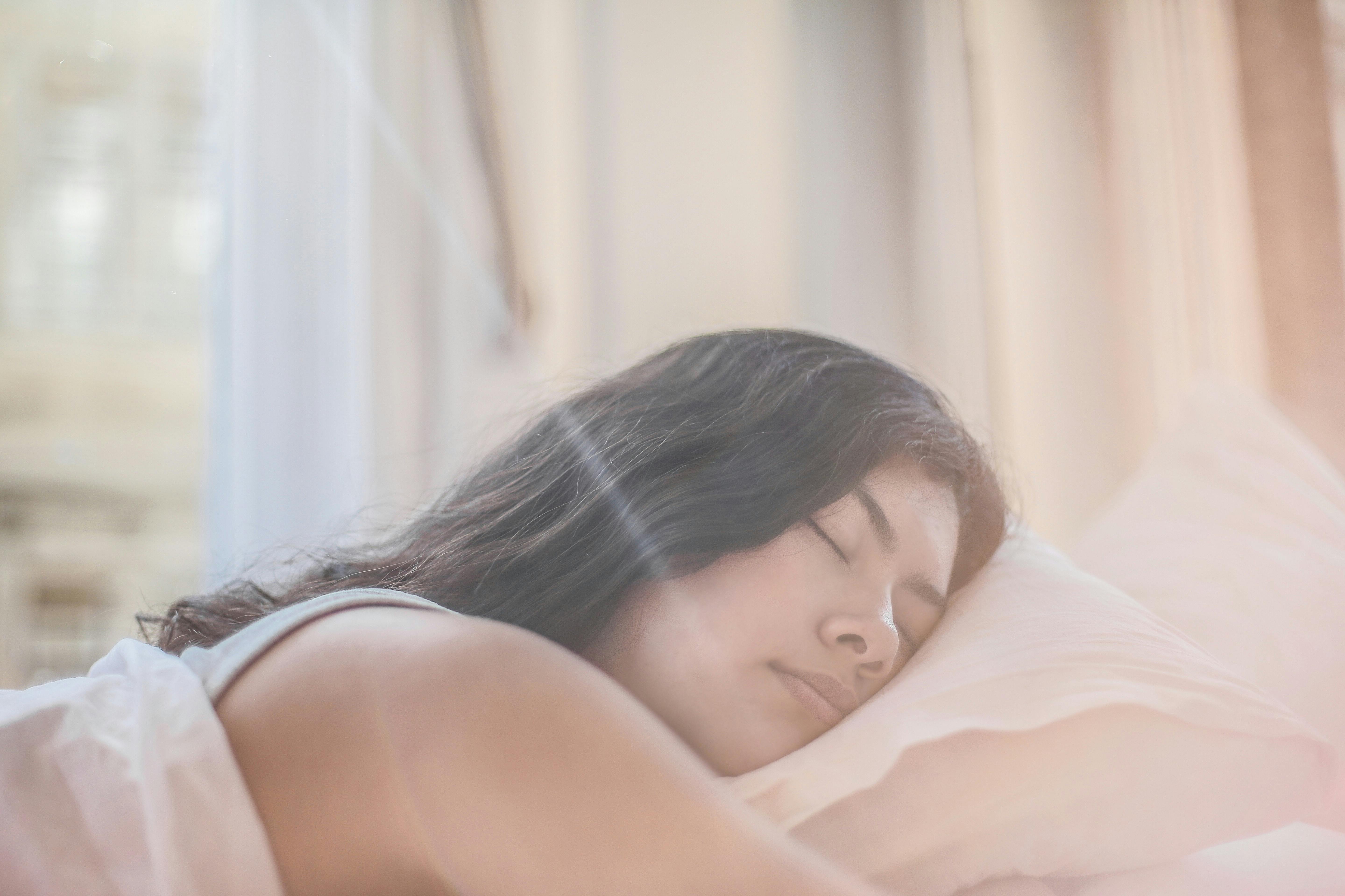 Woman sleeping using melatonin