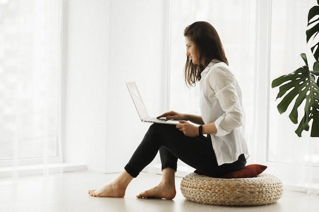 Woman using laptop for telehealth appointment